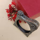 oxidized silver-look bracelet with a floral pattern