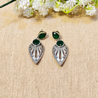 silver earrings with green gemstones