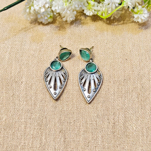 silver earrings with green gemstones