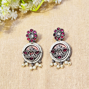 ornate earrings with gemstones